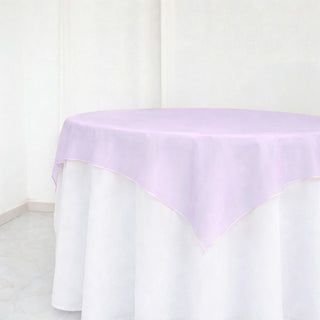 Lavender sheer table overlay on round white table in minimal room