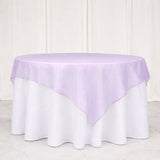 Lavender chiffon table overlay on white round tablecloth
