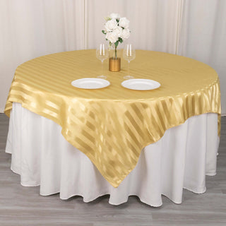 Elevate Your Event with the Champagne Satin Stripe Square Table Overlay