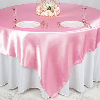Add a Touch of Elegance with the 90"x90" Pink Seamless Satin Square Table Overlay