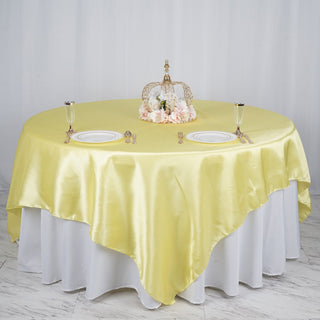 Elevate Your Event Decor with a Stunning Yellow Satin Table Overlay