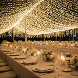 Elegant wedding reception with twinkling lights and beautifully set tables.