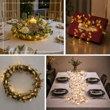 Golden leaf fairy lights decorating elegant dinner table, wreath, and gift box