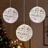 Hanging decorative light orbs in a festive setting.