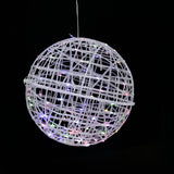 Hanging decorative globe with colorful lights on a black background.