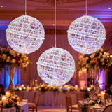 Decorative hanging light orbs in a beautifully arranged event space.