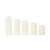 Set of five white pillar candles in varying heights #whtbkgd