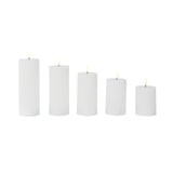 Set of five white LED candles in varying heights #whtbkgd