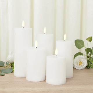 Set of five white LED candles in varying heights, elegant home decor accent.