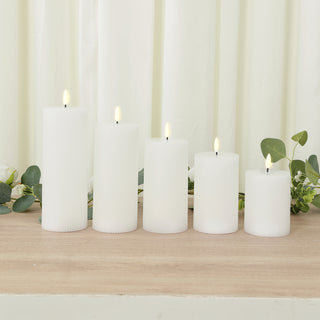 Set of five white pillar candles with realistic flickering flames.