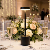 Elegant wedding table centerpiece with LED lamp, roses, candles, and champagne glasses