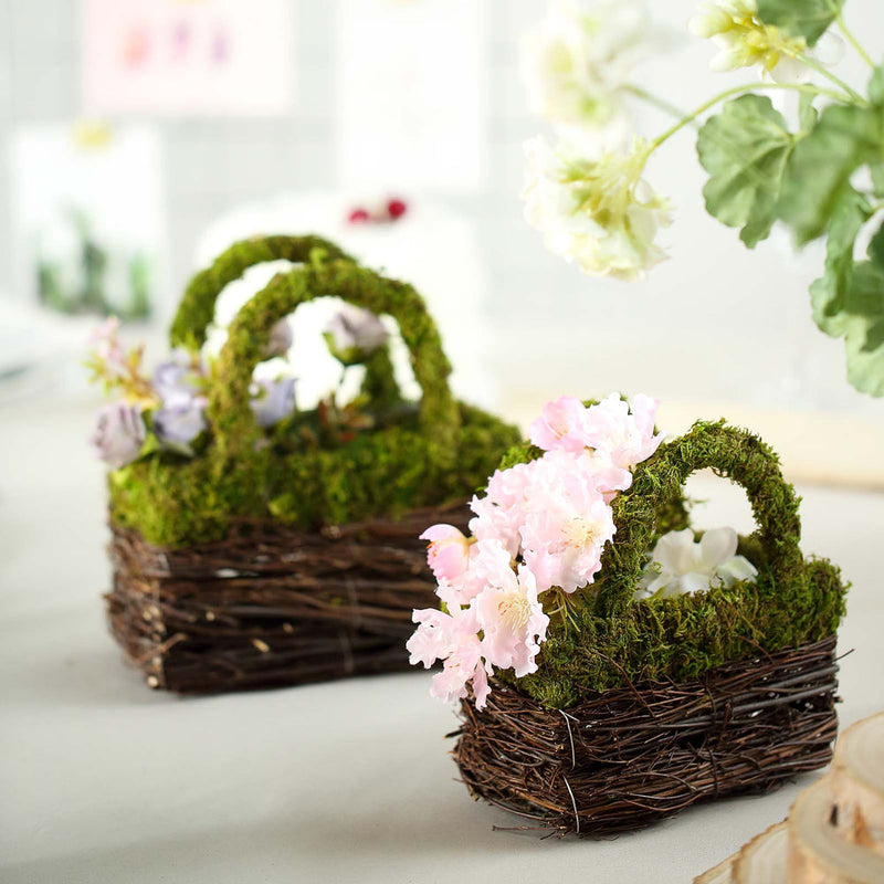 Moss-covered Easter baskets with pink flowers