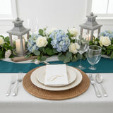 Elegant table setting with floral centerpiece and menu card. Perfect for events.