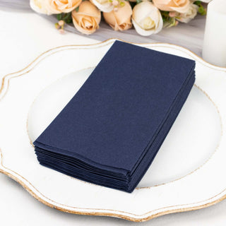 Stack of navy blue cardstock sheets on a decorative plate.