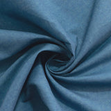 Blue fabric with a soft texture in a swirling pattern. #whtbkgd