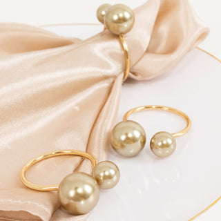 <h3 style="margin-left:0px;"><strong>Beautiful Champagne Pearl Metal Napkin Rings</strong>