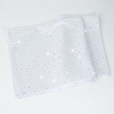 White fabric with sparkling rhinestones