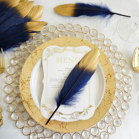 Blue and gold feathers on a place setting