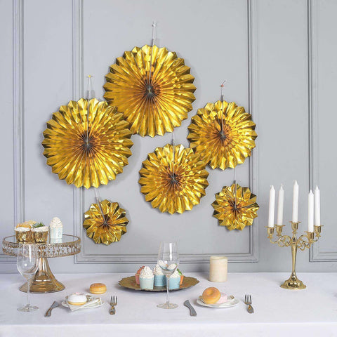 Gold floral wall backdrop over a dining table