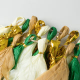 Colorful party decorations with gold and green accents.