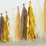Tassel garland in gold, brown, and cream colors for party decoration