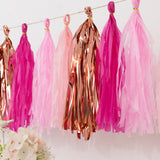 Pink and gold tassel garland decoration for parties and celebrations.