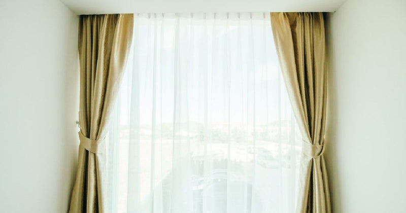 Curtains framing a bright window