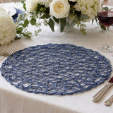 Blue woven placemat on elegant dining table with white floral centerpiece