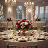 Elegant floral centerpiece on a beautifully set dining table for an event.