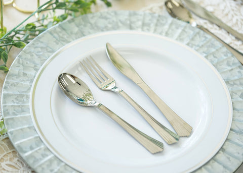 Place setting with white plate and silver cutlery