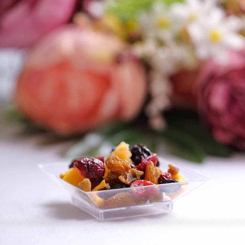 Clear plastic dessert bowl with dried fruit