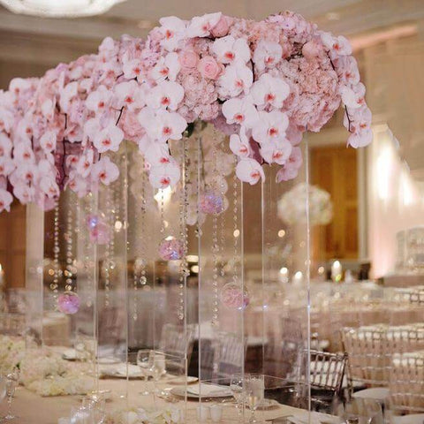 Acrylic box with hanging flowers and a dessert display