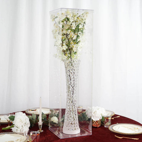 Acrylic display box with gold vase and white flowers