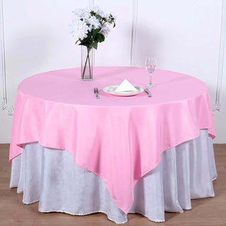 Add Elegance to Your Event with the 70x70 Pink Square Seamless Polyester Table Overlay