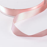 Pink satin ribbon on white background