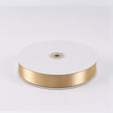 Gold satin ribbon spool on white background#whtbkgd