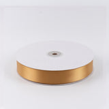 Gold satin ribbon spool on white background#whtbkgd