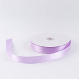 Lavender satin ribbon spool on white background