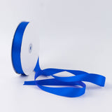 Blue satin ribbon spool on white background