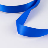Blue satin ribbon on white background, close-up abstract product image