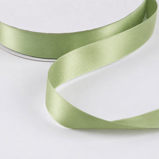 Light green satin ribbon on white background