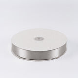 White satin ribbon spool on a white background#whtbkgd