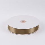 Gold satin ribbon spool on white background#whtbkgd