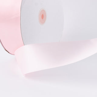 Pink and white LED ceiling light with modern curved design