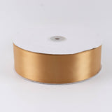 Gold satin ribbon spool on white background#whtbkgd