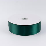 Green satin ribbon spool on a white background#whtbkgd