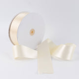 Ivory satin ribbon spool with elegant flowing ribbon on white background