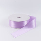 Lavender satin ribbon roll on white background