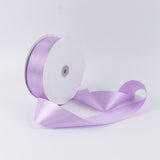 Lavender satin ribbon spool on white background