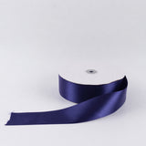 Purple satin ribbon spool on white background